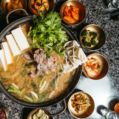 A Korean hot pot with tofu and greens