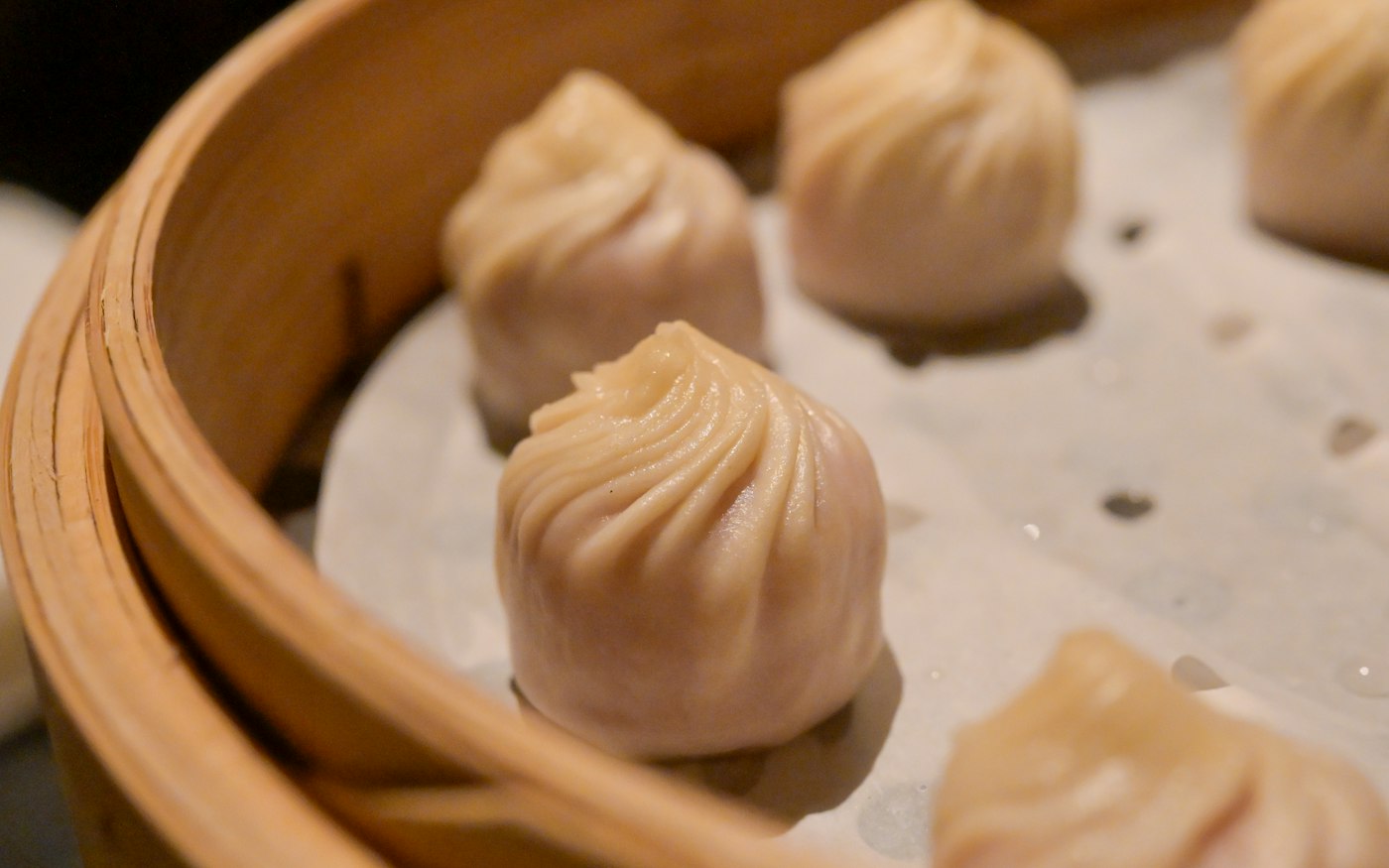 Soup dumplings in a bamboo steamer